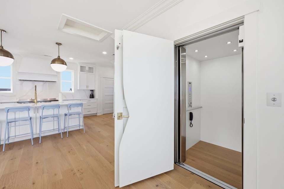 Private hallway with elevator access and high-end stainless appliances for added convenience