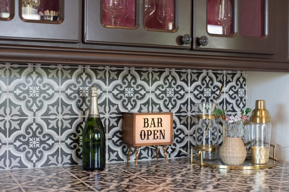 Wet bar features ice maker and wine refrigerator