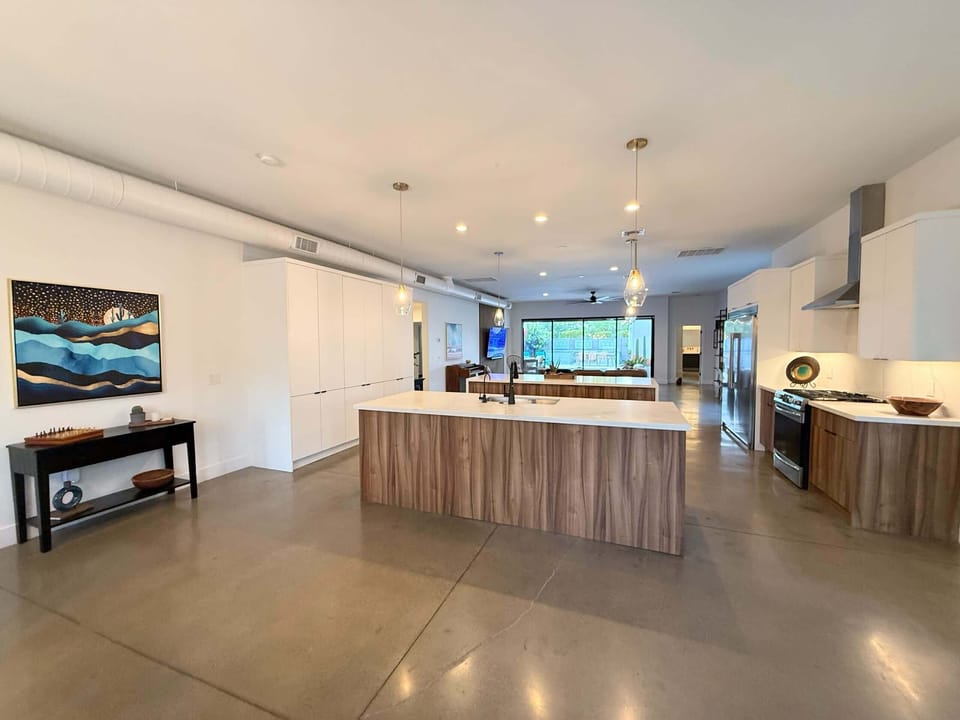 Open kitchen with island and breakfast bar 