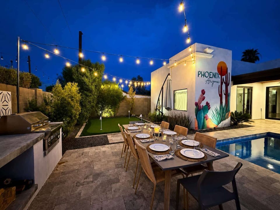 Patio Dining Next to Pool, BBQ and Putting Green Under String Lights