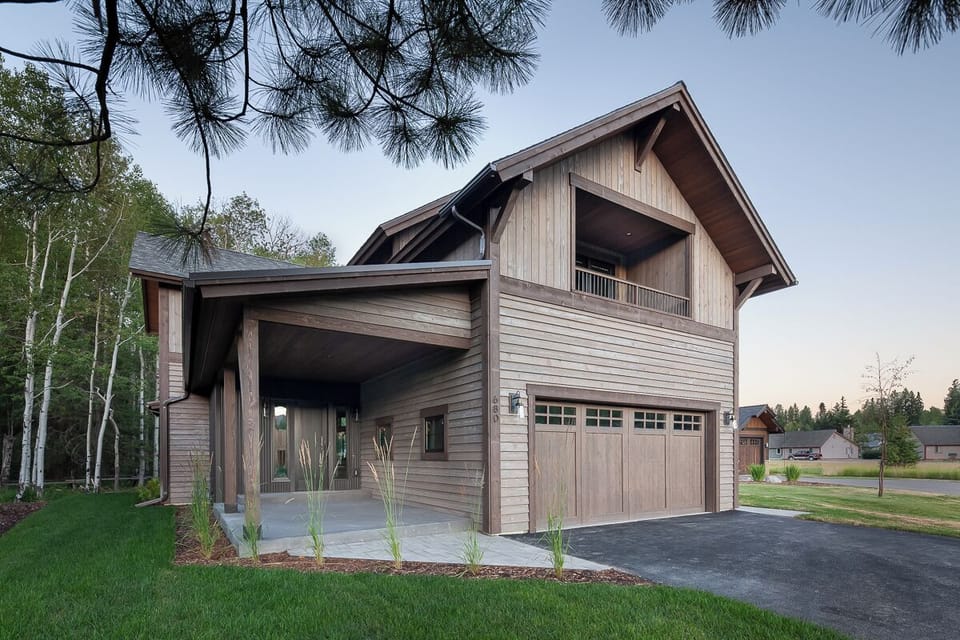 Arrive to a modern timber retreat with easy driveway access.