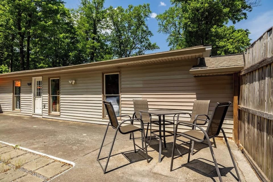 Relax under the trees while enjoying fresh mountain air, comfortable patio seating, and plenty of open space for family gatherings, games, or simply unwinding outdoors.