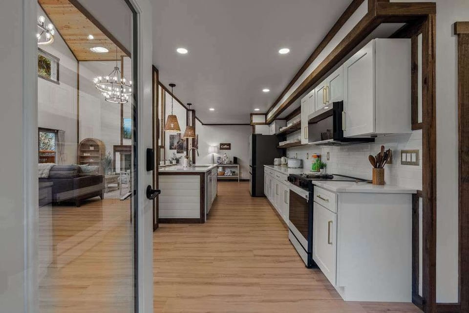 A fully equipped kitchen with generous counter space, modern appliances, and an open layout perfect for preparing meals together.