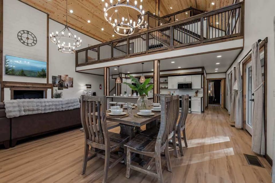 Share meals, laughter, and lasting memories in the spacious dining area, seamlessly connected to the kitchen and soaring two-story great room.