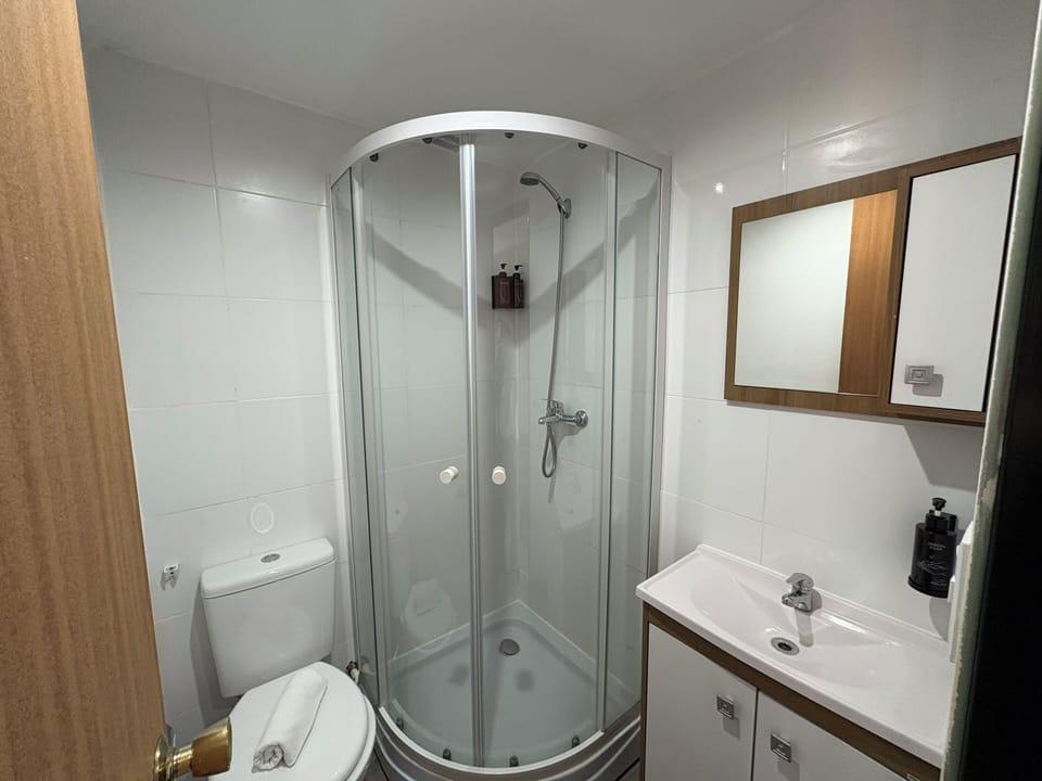 Classic Double Room, Balcony, Garden View | Bathroom | Shower, towels, soap, shampoo