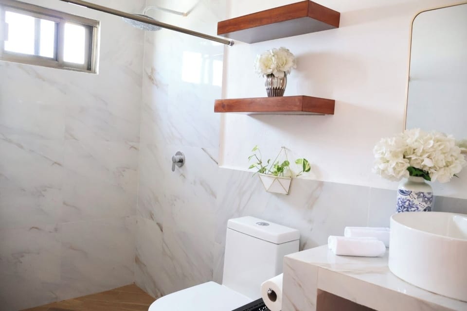 Family Room, 2 Queen Beds, Private Bathroom | Bathroom | Shower, towels, soap, shampoo