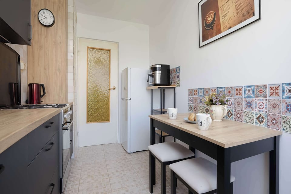 The kitchen offers a functional layout for convenient cooking.