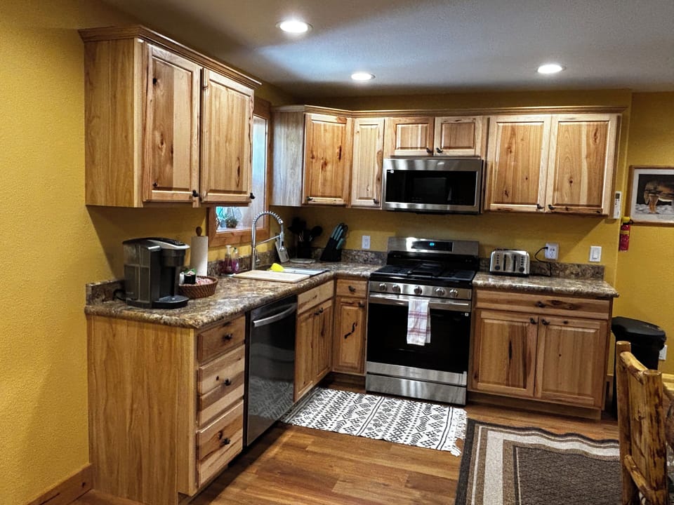 new kitchen. gas range, microwave, coffee maker, dish washer