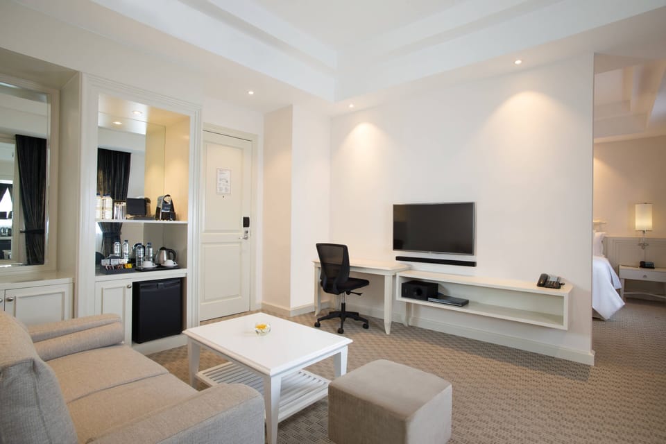 Suite, 1 King Bed | Living area | 55-inch LED TV with satellite channels, Netflix, streaming services