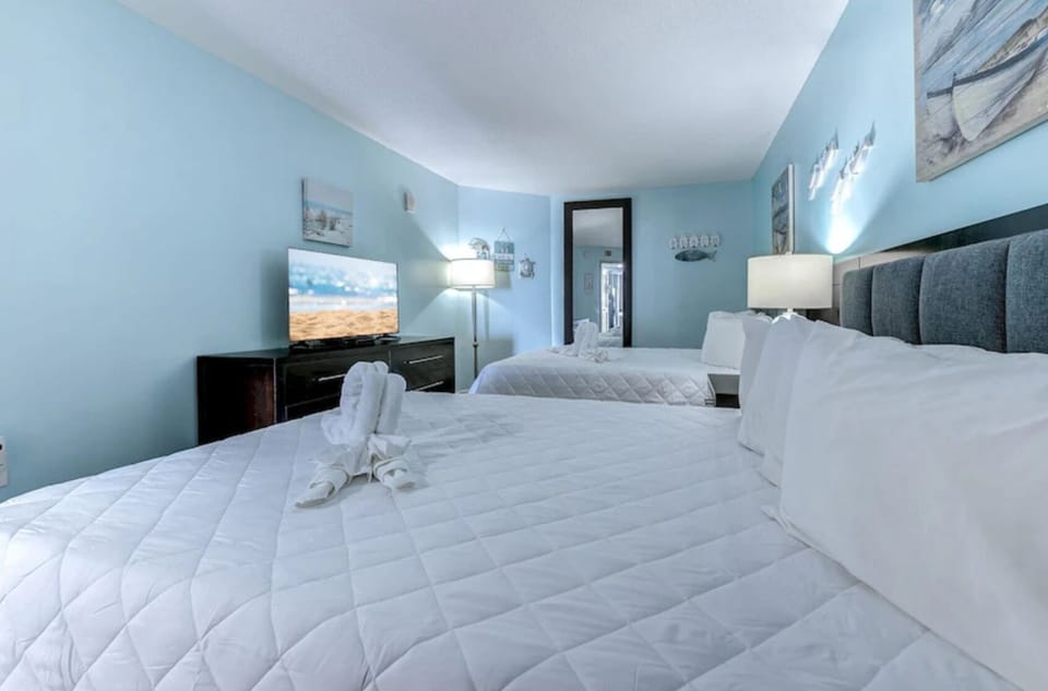 Bright bedroom with natural light and coastal accents.