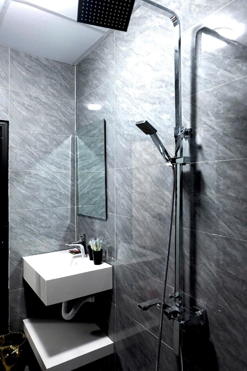 Shower, free toiletries, hair dryer, slippers