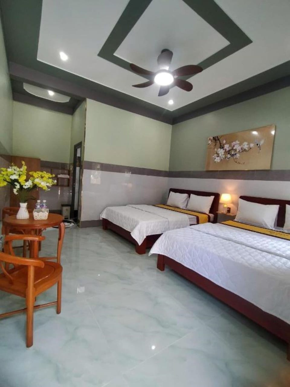 Deluxe Quadruple Room | Desk, WiFi (free), bed sheets