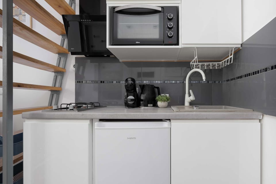Well-equipped kitchenette with a coffee maker, and storage space.