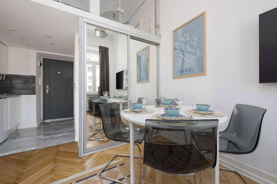 Modern open-plan living and dining area with contemporary furnishings.