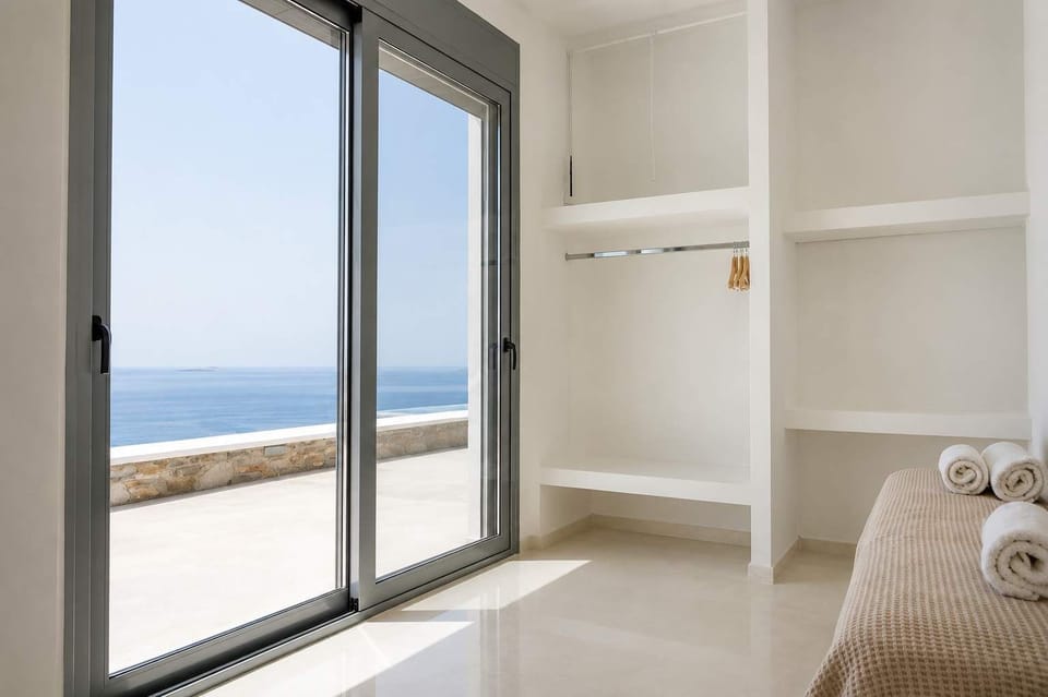 Bright bedroom retreat with sea views and hotel-style comfort.