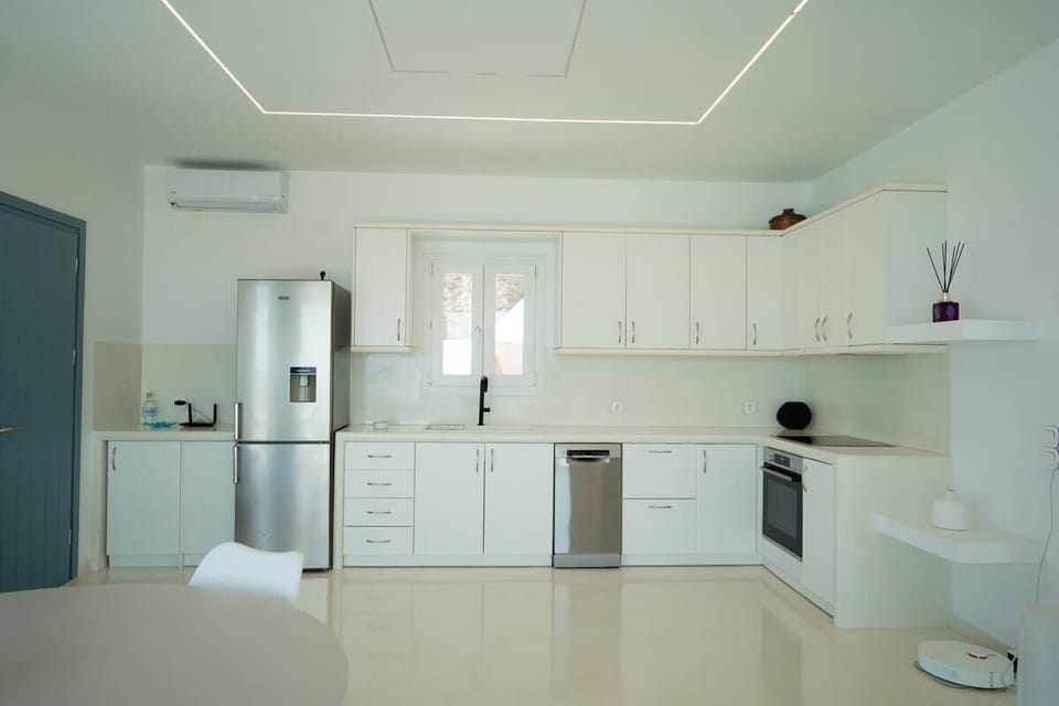 A sleek, fully equipped kitchen with clean modern design.