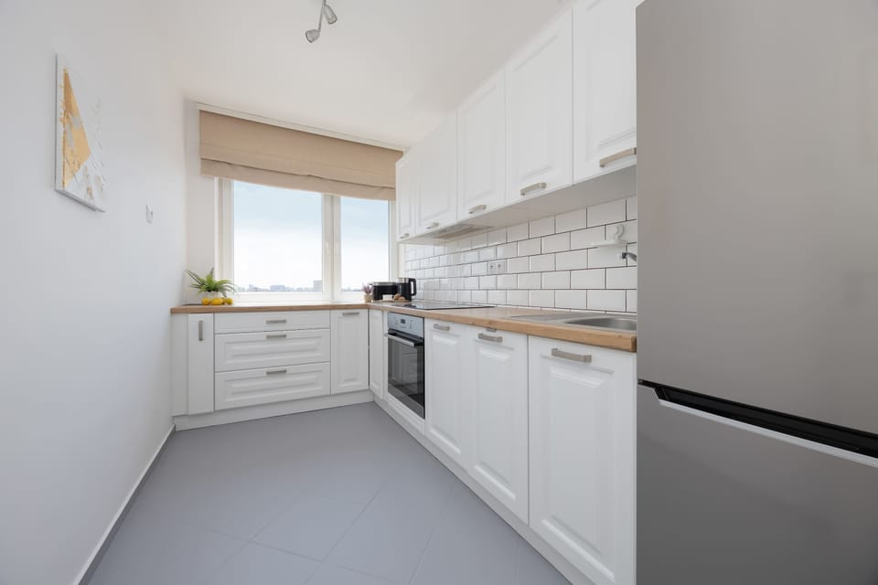 A fully equipped kitchen with modern appliances and generous countertop space. Prepare your favorite meals with everything you need close at hand.