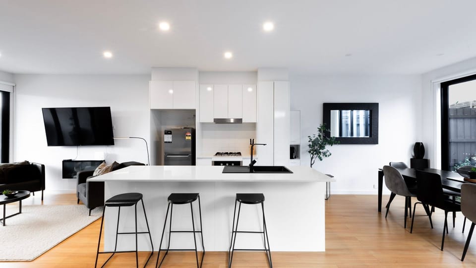 The stylish kitchen is fully equipped with everything you need for home-cooked meals.