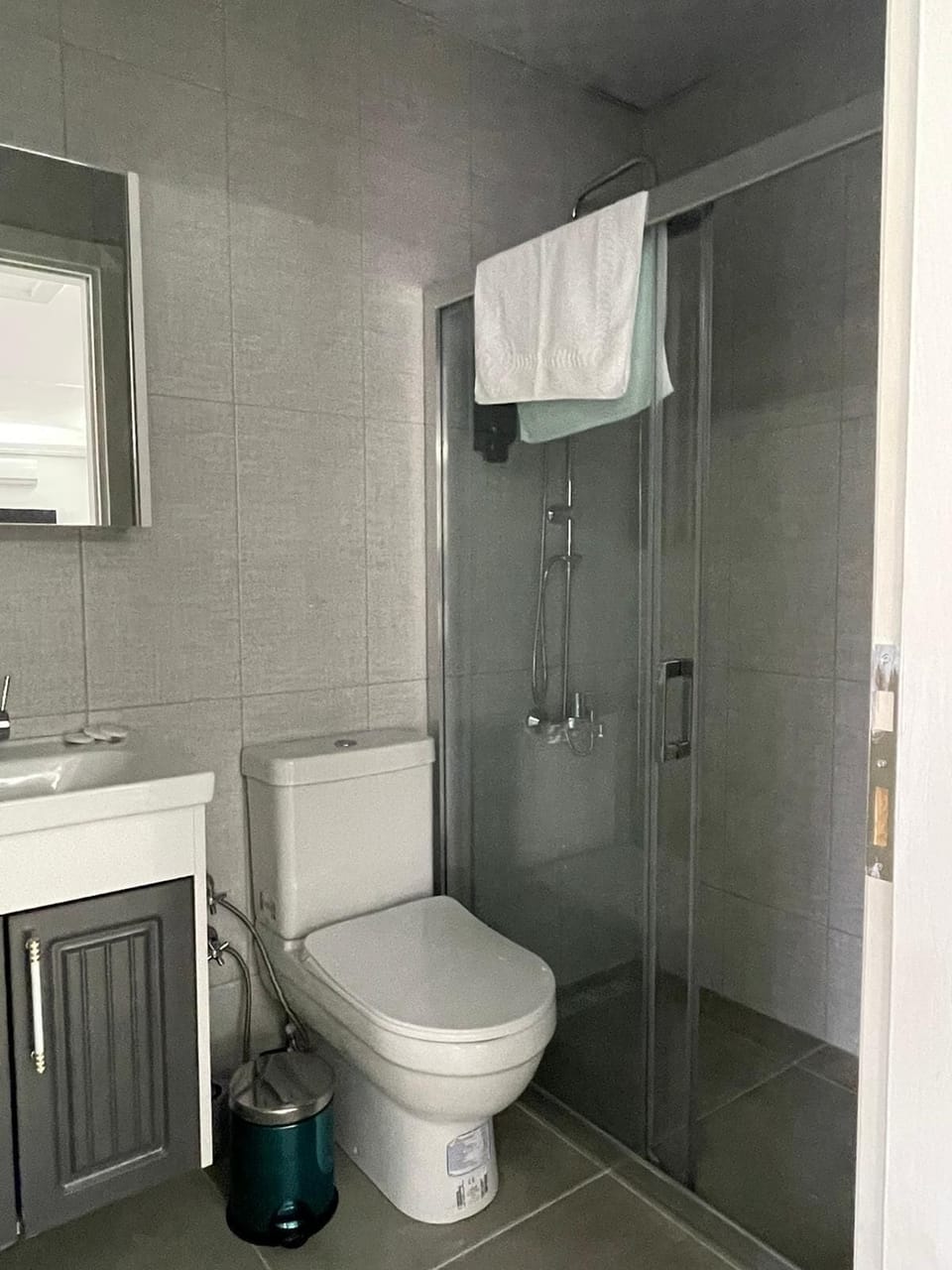 Deluxe Quadruple Room, Balcony, Garden View | Bathroom | Shower, hair dryer, slippers, towels