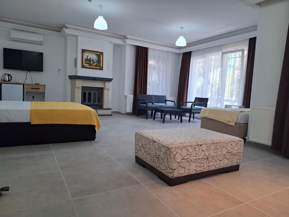 Deluxe Quadruple Room, Balcony, Garden View | In-room safe, WiFi (free)