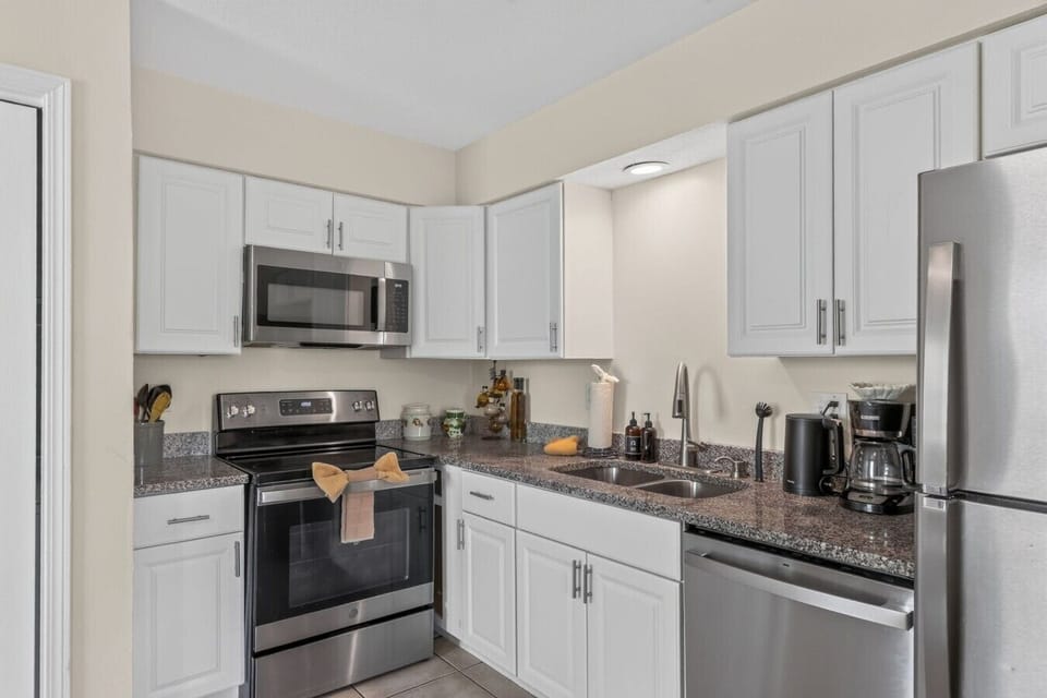 Cook comfortably with a full-size range, microwave, dishwasher, refrigerator, and plenty of counter space.