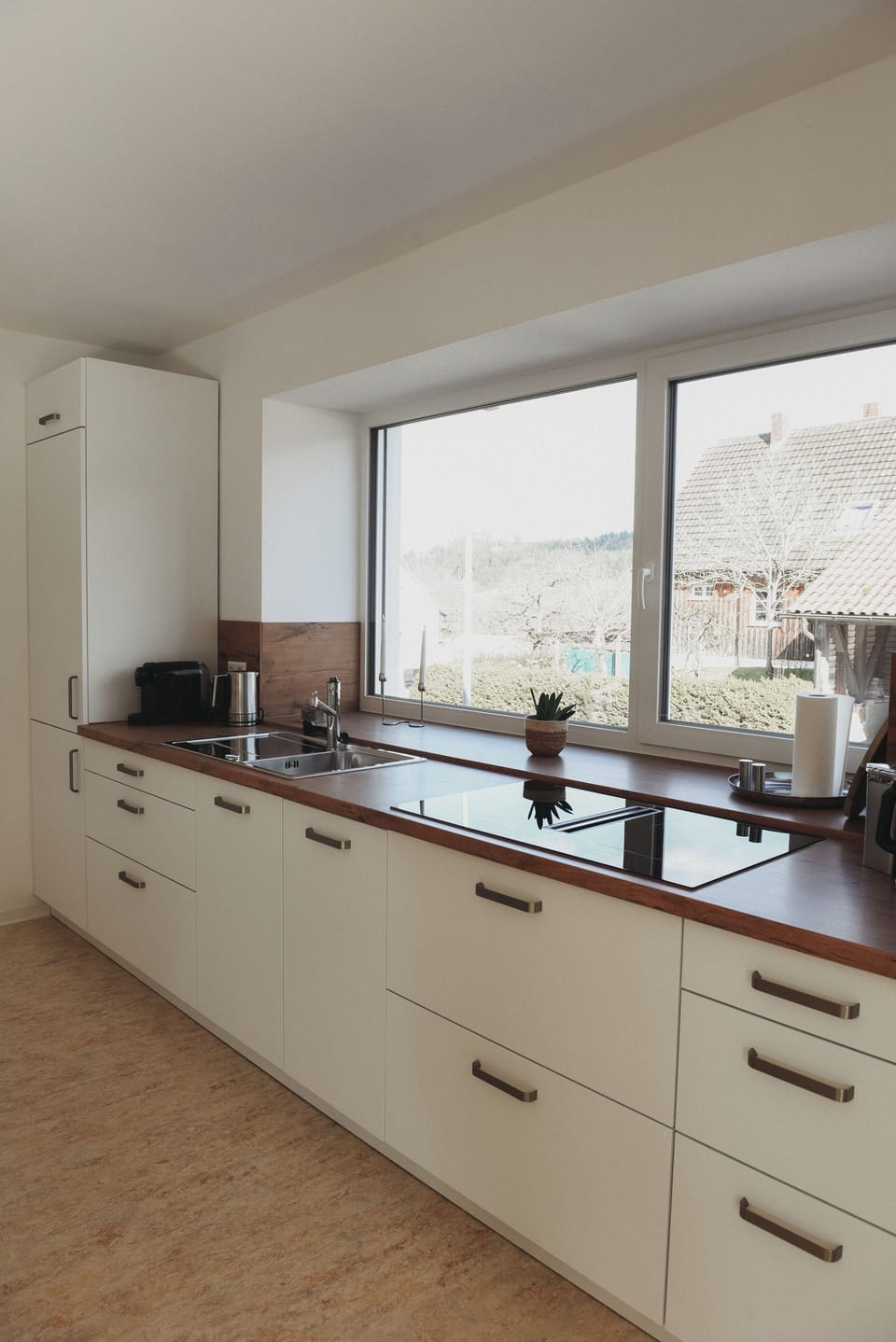 Bright, modern kitchen with induction hob, double sink & garden views