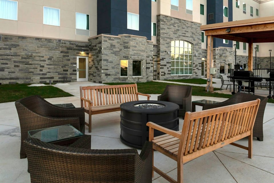 Gather around the fire pit, perfect for cozy evenings with friends.