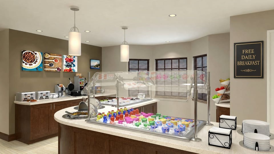 Start your day right with a vibrant breakfast spread featuring fresh fruits, yogurts, and more.