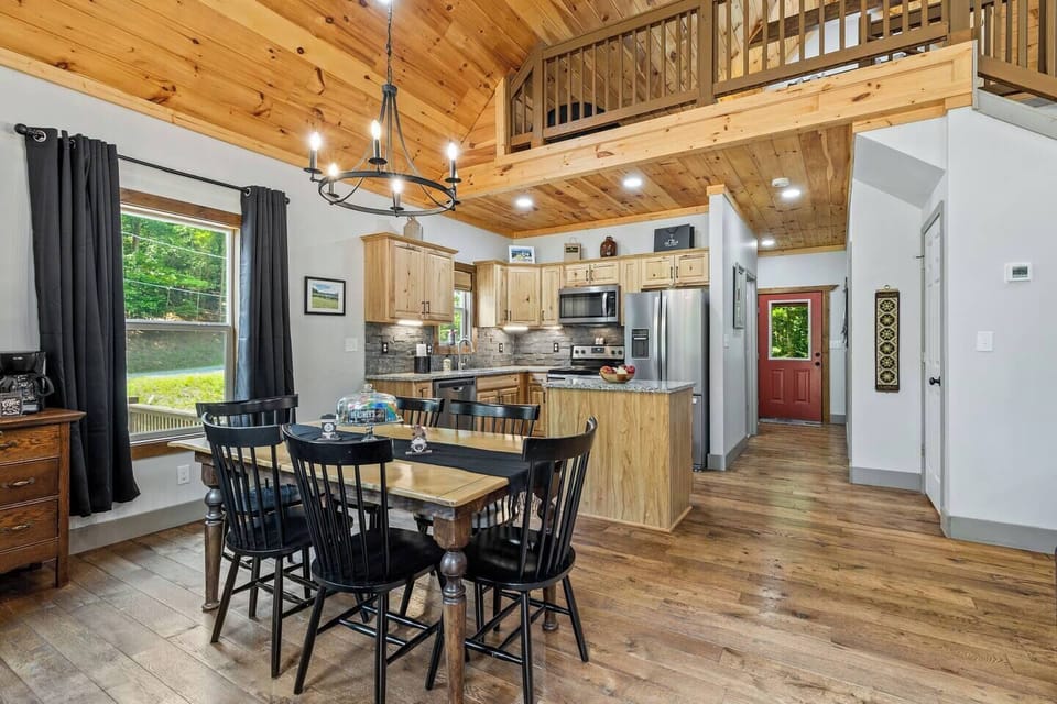 Open concept dining room with seating for 6 along with coffee bar. 