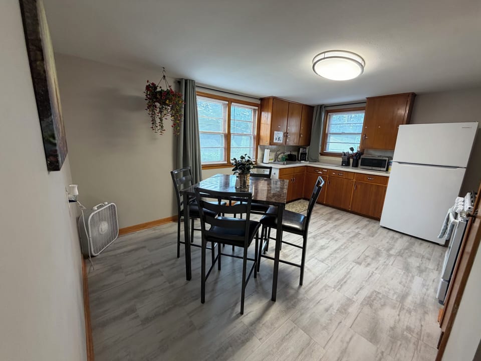 Dining table, gas oven, fridge/freezer, microwave, coffee maker, and more!
