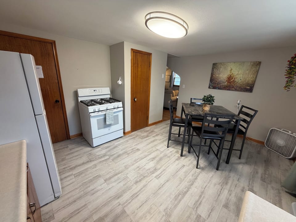 Dining table, gas oven, fridge/freezer, microwave, coffee maker, and more!