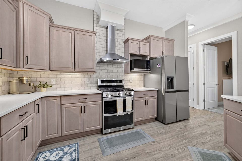 Cook family meals with ease in this spacious kitchen featuring stainless steel appliances and plenty of storage.