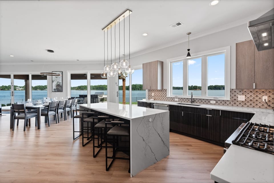 Beautiful fully stocked kitchen with lake views all around!