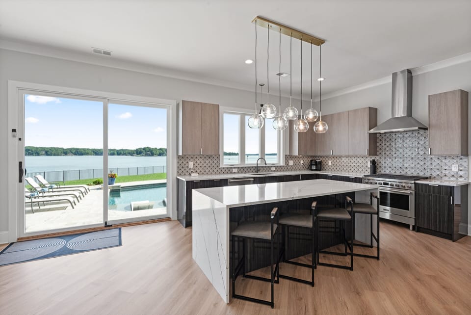 Enjoy the fully stocked kitchen to prep all your group meals with large island.