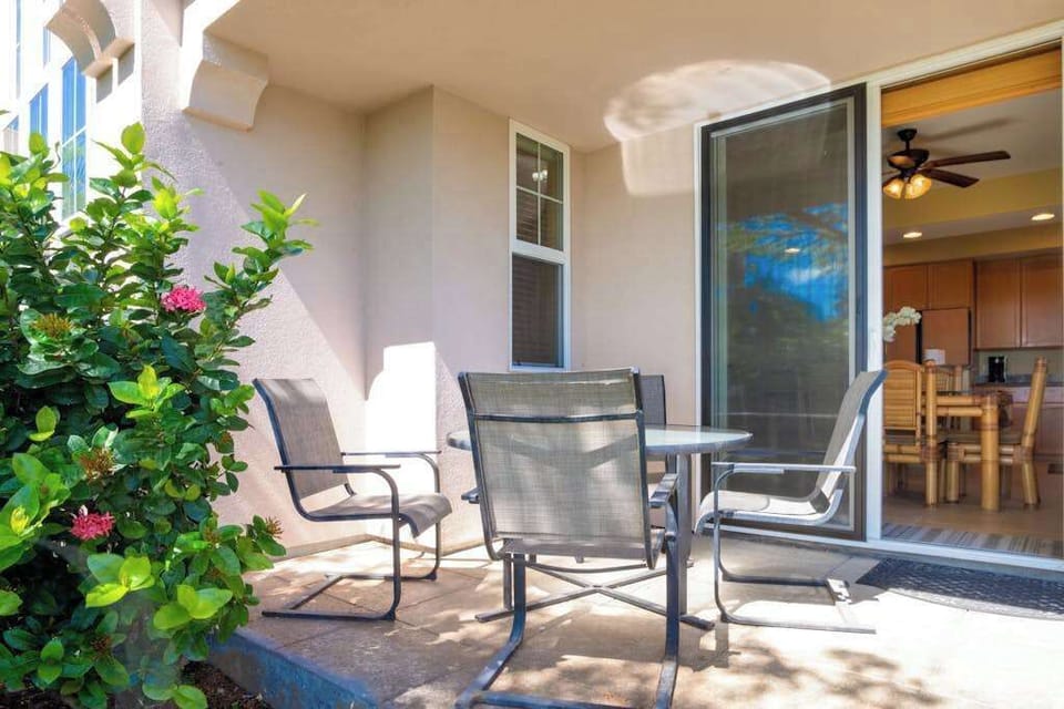 Relax on the private lanai surrounded by tropical greenery