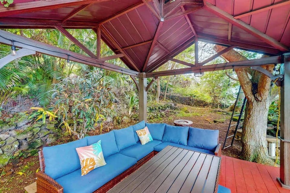 Covered pavilion creates a retreat with garden seating and shade