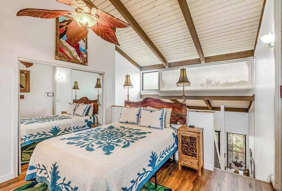 Airy Bedroom Beneath Vaulted Ceilings