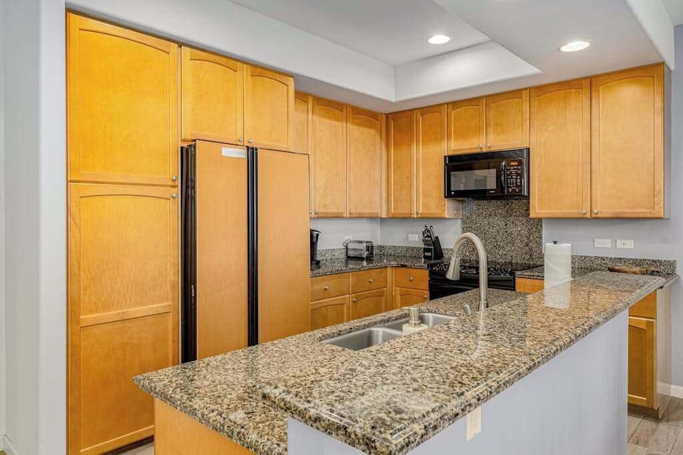 Chef's Kitchen With Granite Island