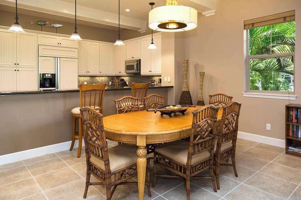 Elegant Dining Area with Seating for Six Adjacent to Kitchen Bar