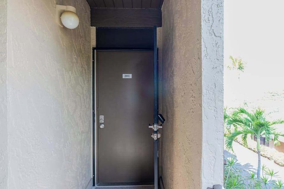 Glass Sliding Door Access, Exterior Lighting & Scenic Palm Views