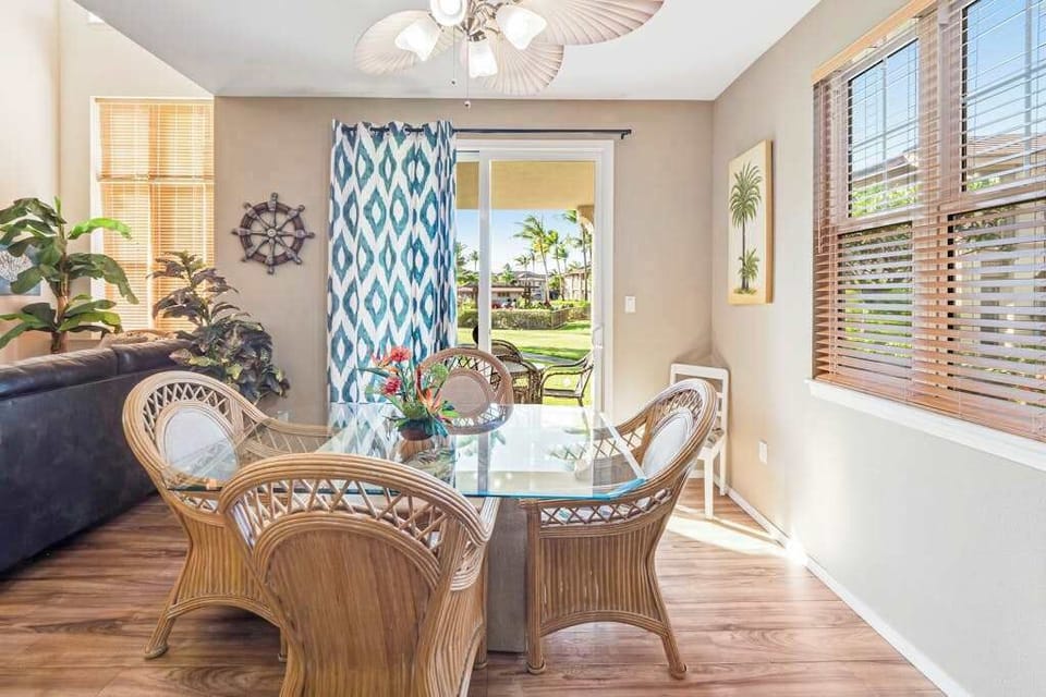 Dining room with seating for four and views of the lanai.