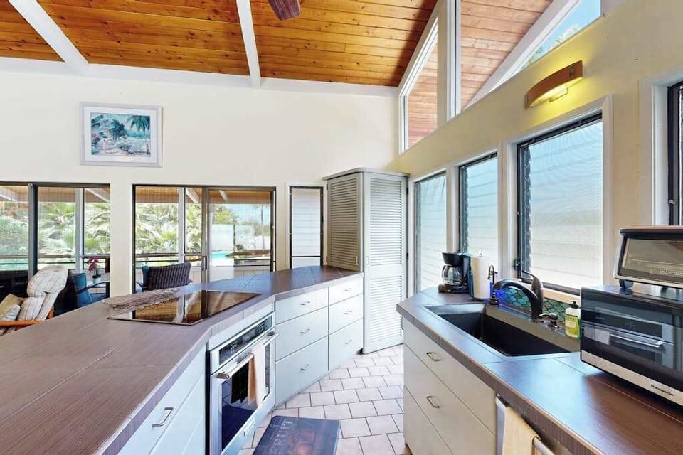 Gourmet Kitchen Prep Area with Modern Appliances & Garden Views