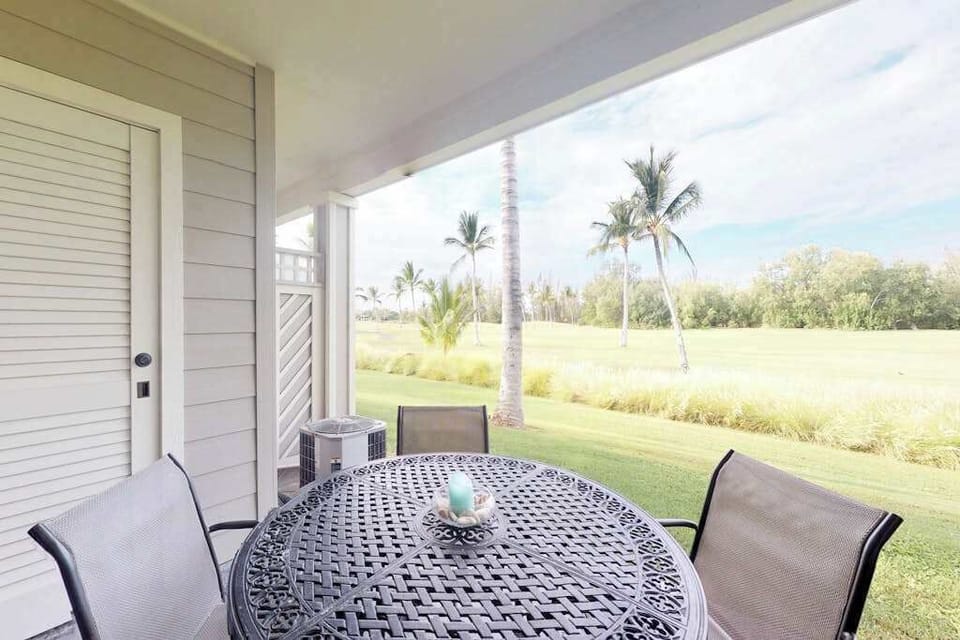 Covered lanai with peaceful garden views