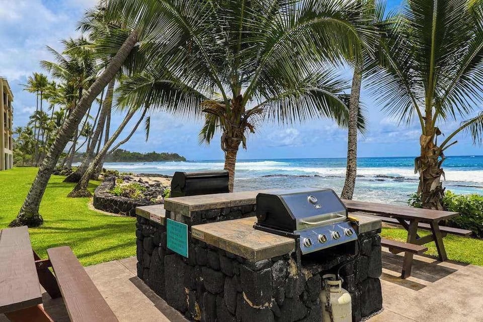 Oceanfront BBQ Area Beneath Swaying Palms