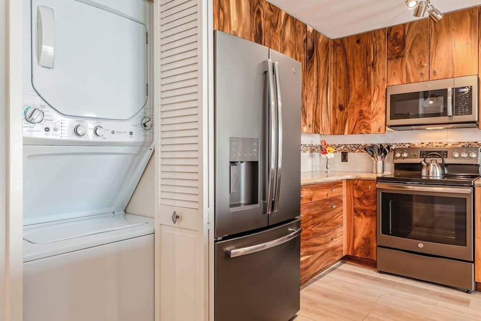 Fully Equipped Gourmet Kitchen with In-Unit Stacked Washer & Dryer