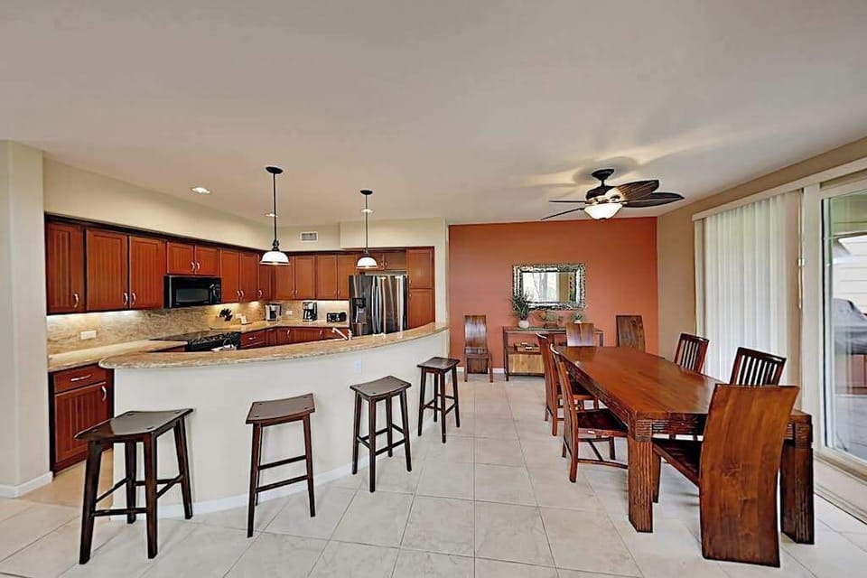 Large island for extra counter space and four barstools for extra seating. 