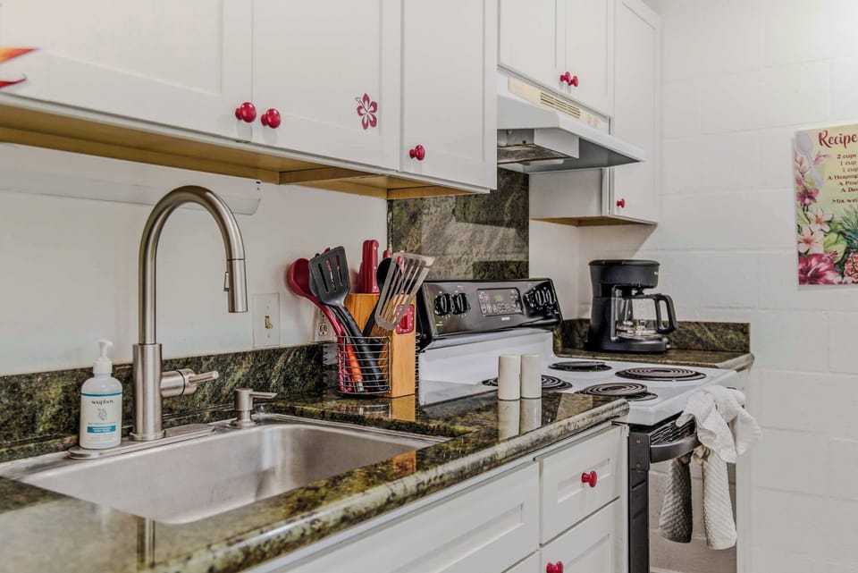 Modern kitchen workspace featuring a gooseneck faucet, deep sink, and sleek countertops. 🍳✨
