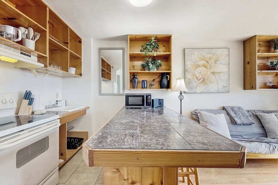 Cook, dine, and enjoy shared moments in this welcoming kitchen and dining area.