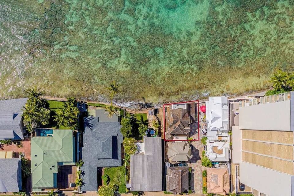 Aerial view showcases the home's inviting layout and peaceful surroundings beautifully together