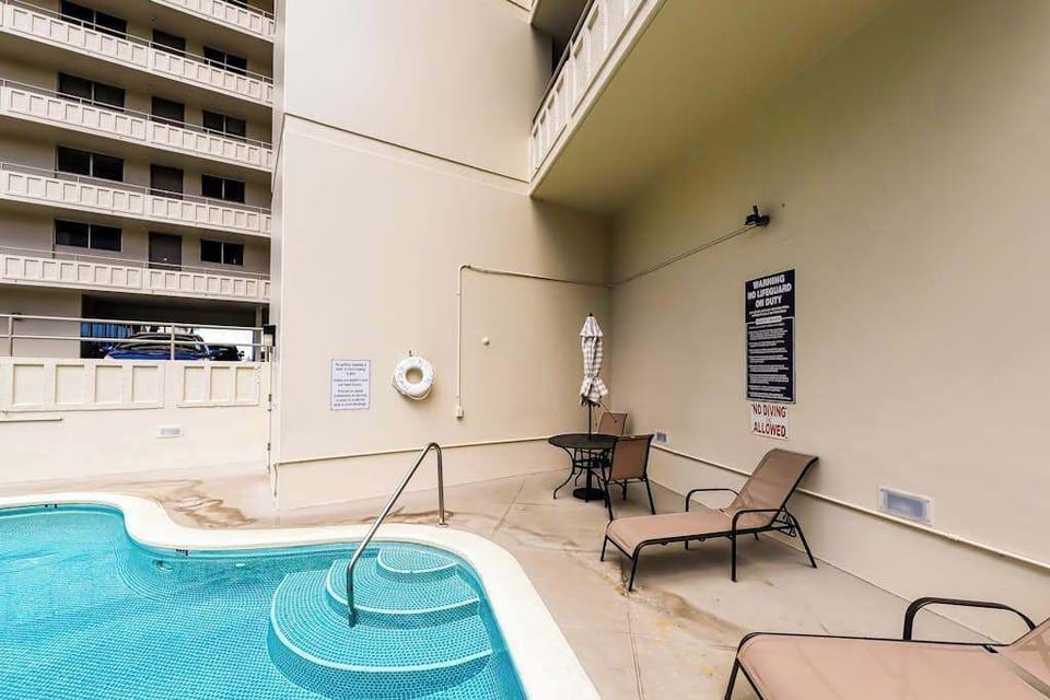 Take a leisurely dip in the inviting shared pool during your stay.